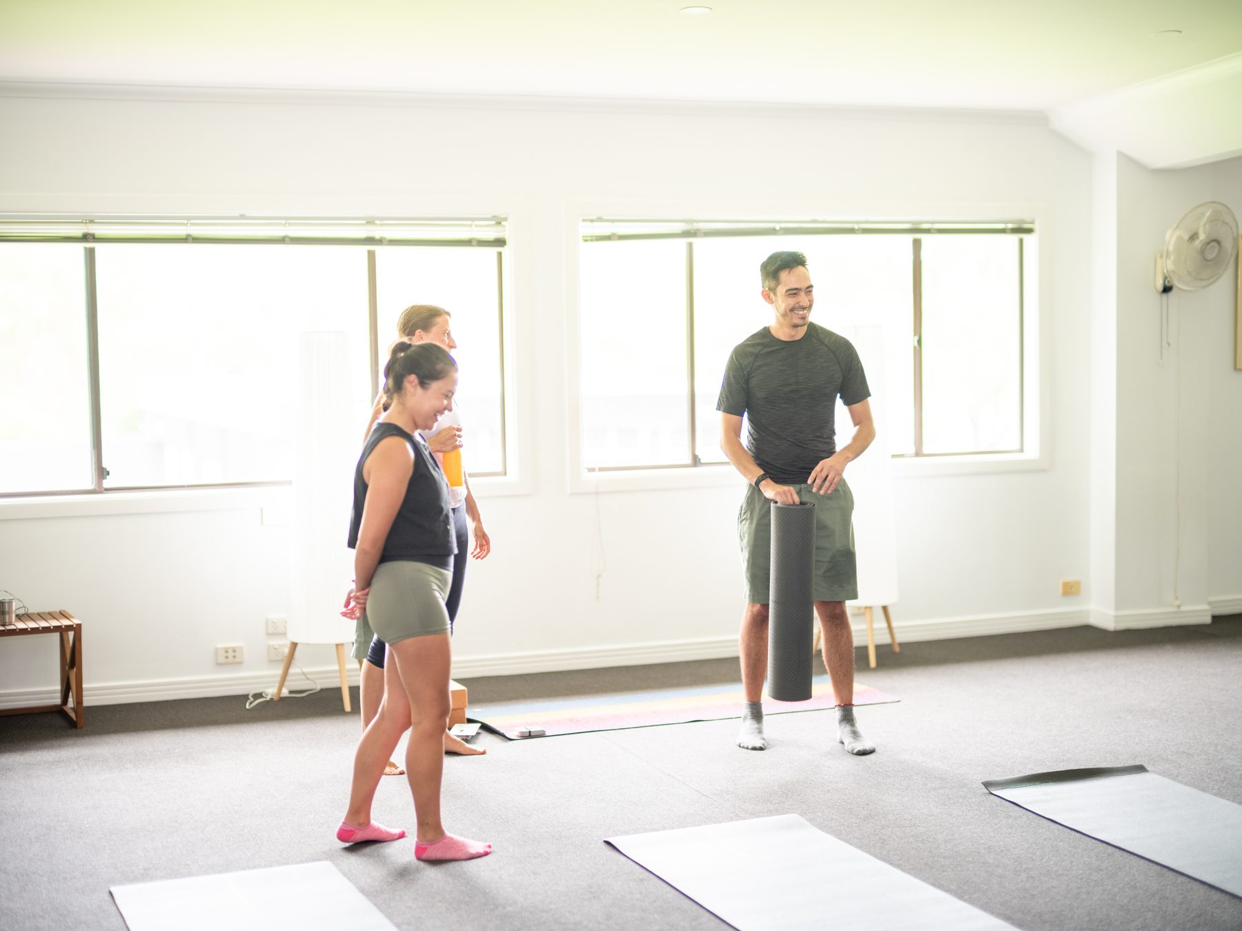 People gathered together in the SuperSoul Yoga Community studio