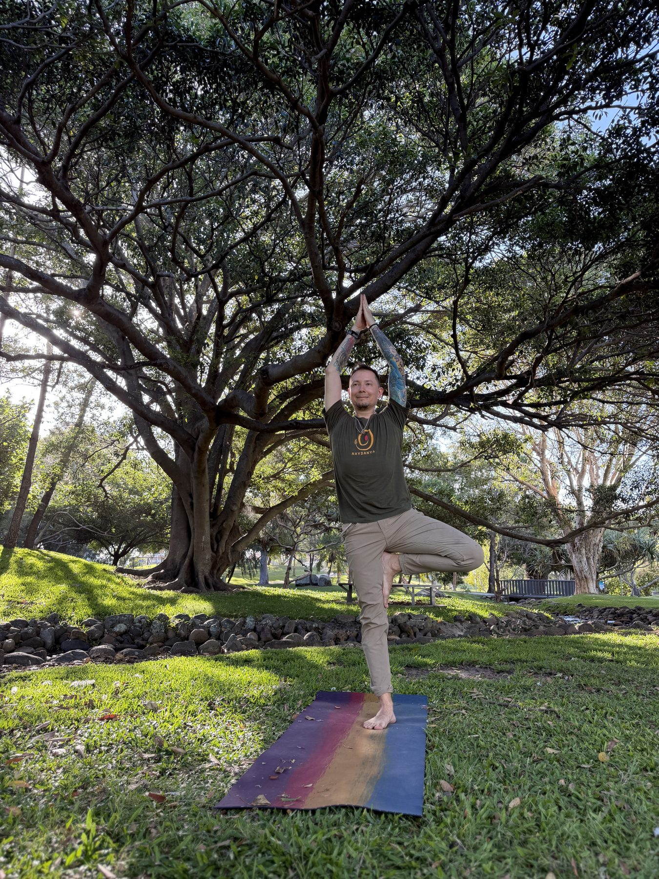 Dan Rupa practising yoga in a park