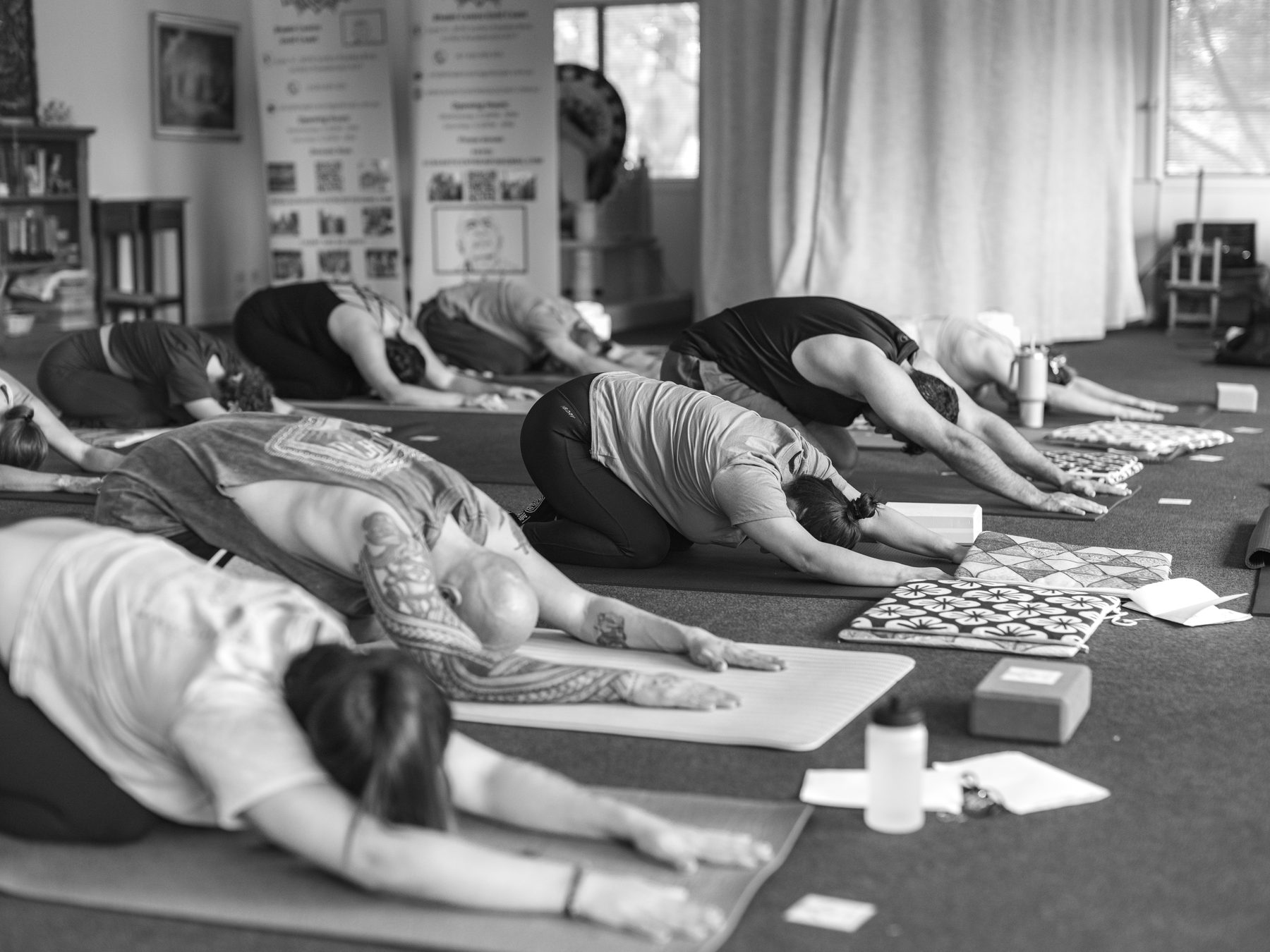 A yoga class resting in child's pose